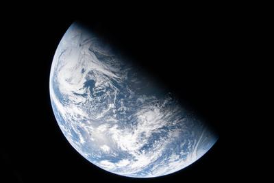 Earth half-lit on the outbound journey
